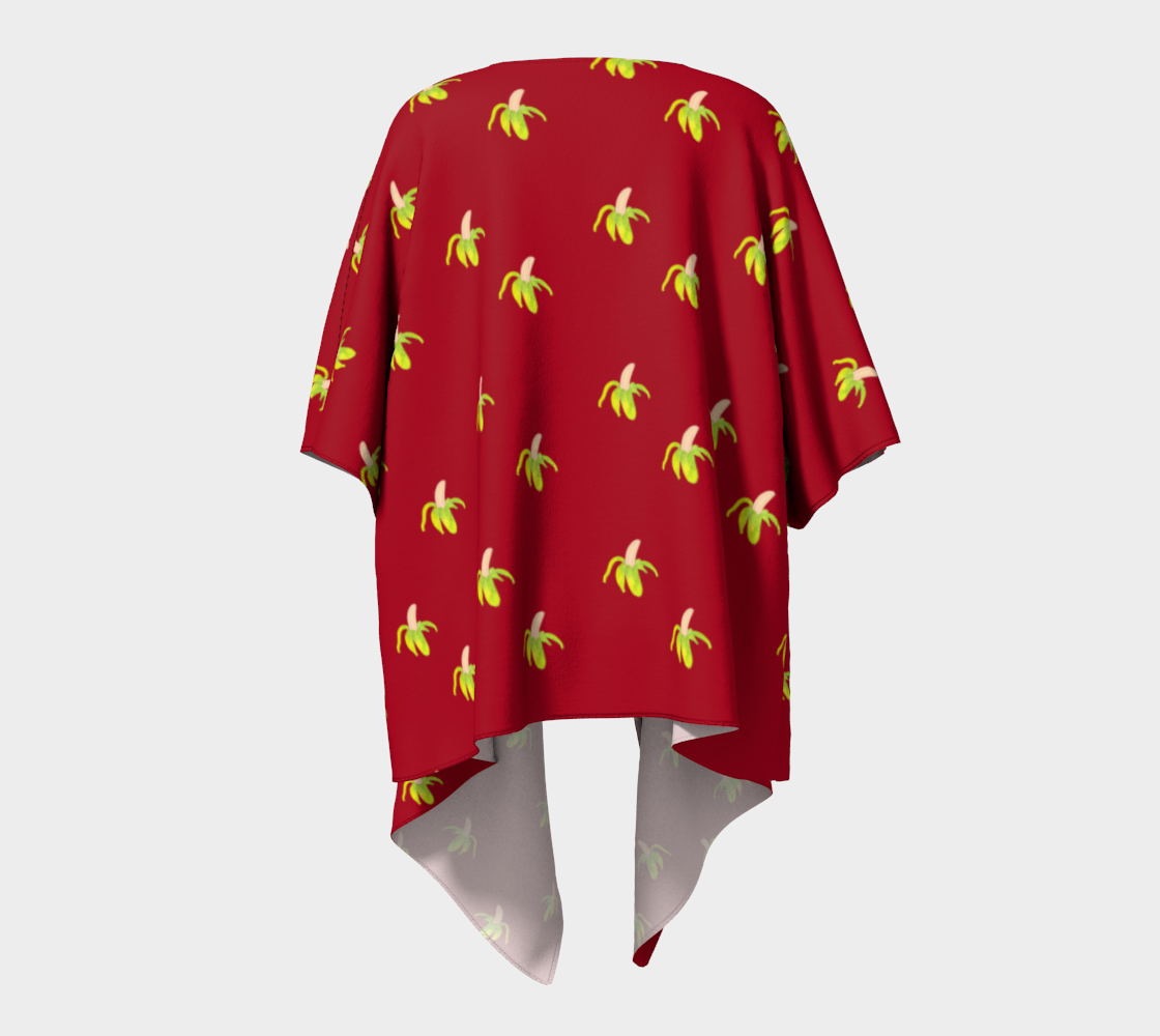 peeled banana on red draped Kimono