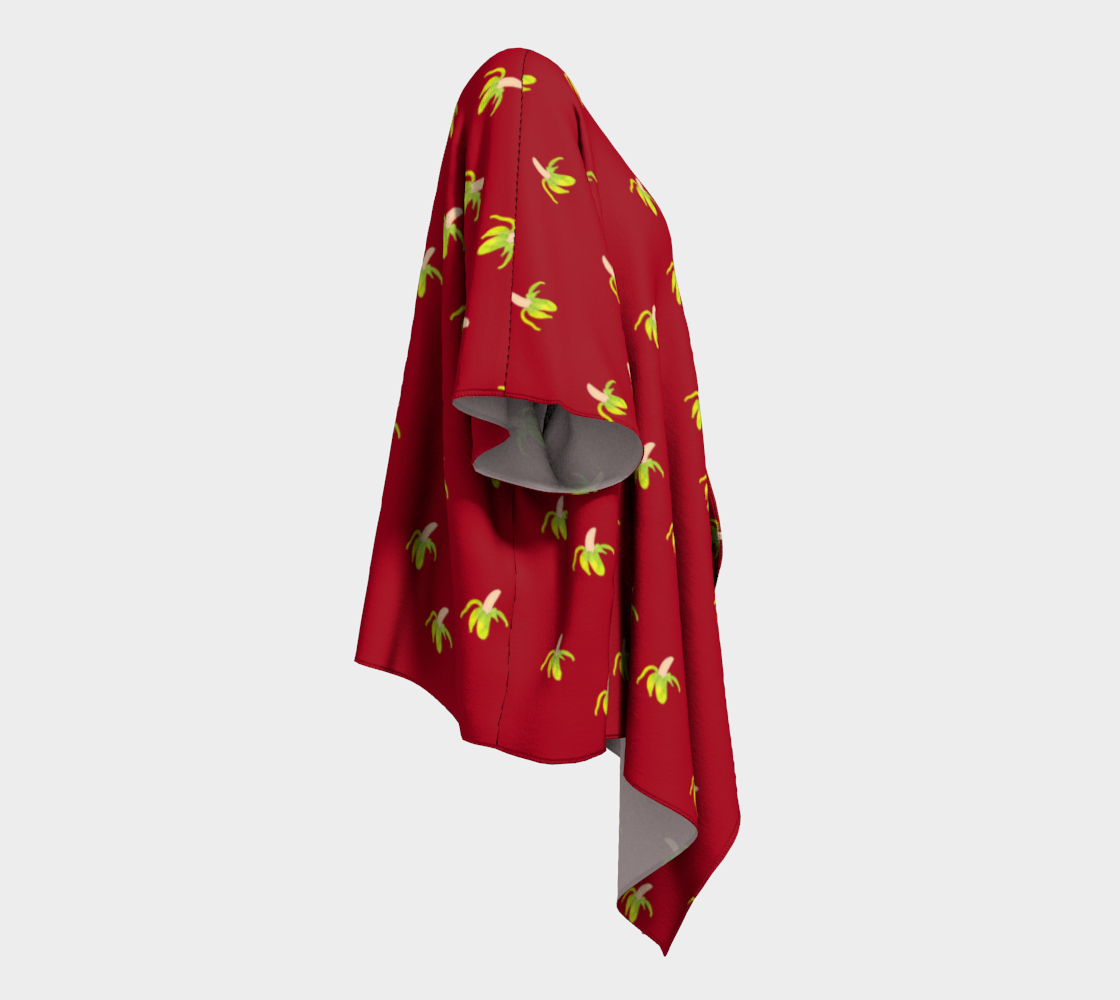 peeled banana on red draped Kimono